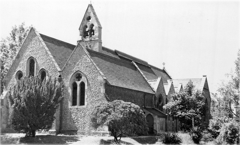 Photo of Christ Church during the Bartle era showing the east and north walls and the growth of trees around it
