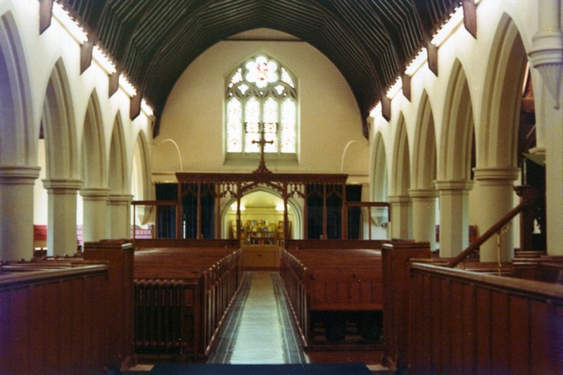 Photo of the Nave within Christ Church looking to the west wall and showing the oak screen in its final position at the end of the nave.