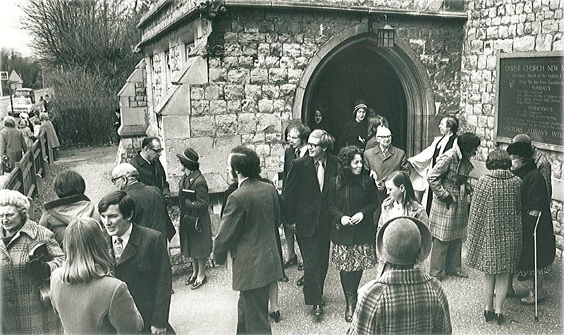 Peter Coombs pictured in 1975 outside the old entrance to Christ Church greeting members of the congregation as they leave