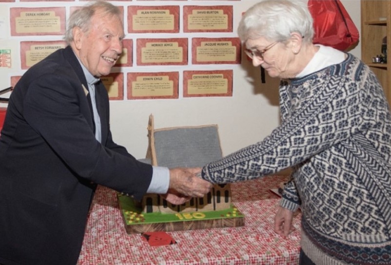 Peter Coombs with Sheila Short cutting the cake at the 150th anniversary