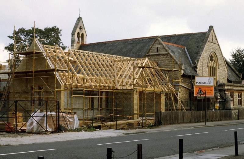 Photo showing the building of the Christ Church Centre in progress with the wooden roof rafters in place