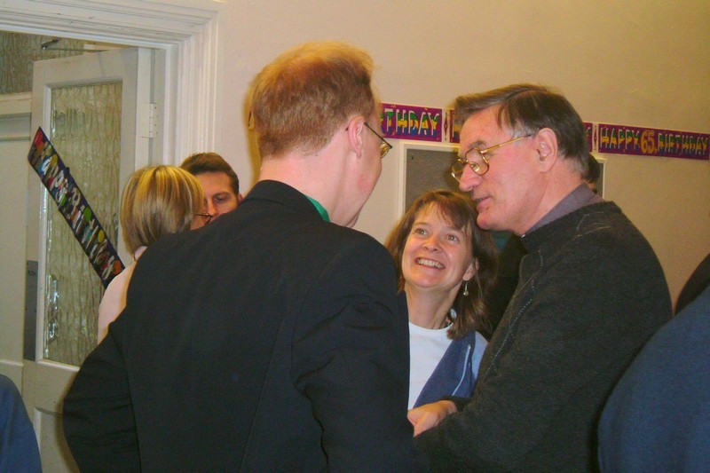 Stewart Downey at his 65th birthday celebration, talking to Stephen Kuhrt and Sarah Parker