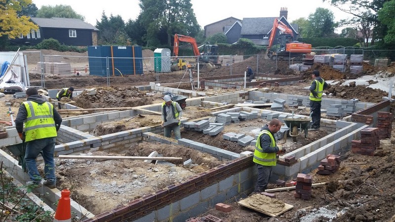 Photo showing builders at work on building the new Vicarage; although at an early stage, the layout of the ground floor rooms is evident
