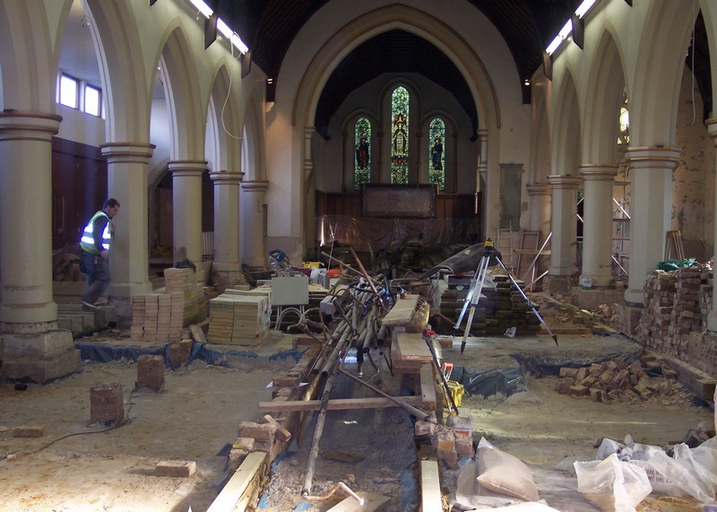 Photo of the church interior during the re-ordering after removal of the floor, as viewed towards the east wall