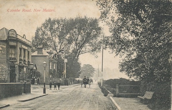 Sepia postcard of Coombe Road, New Malden looking north, a horse drawn trap approaching, and on the left the Royal Oak