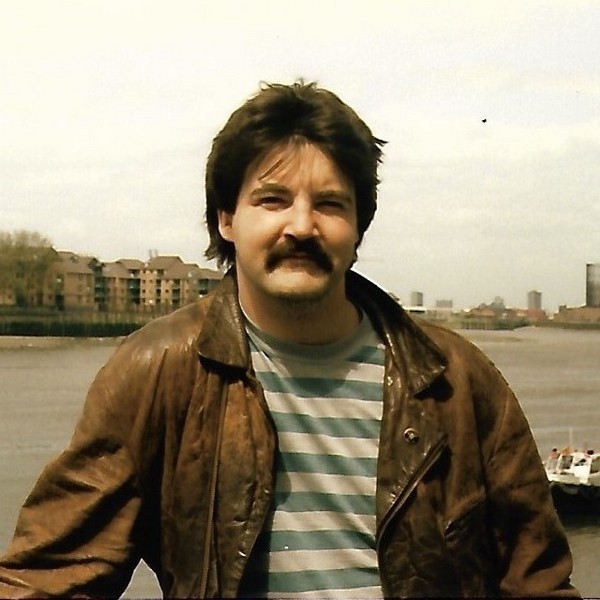 Photo of John Morris from the 1980s with the Thames as backdrop