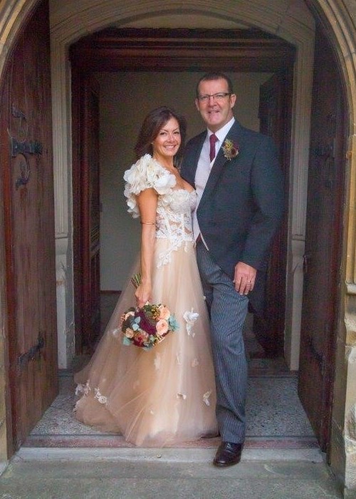 John and Georgie Morris at the doorway to the church, at their wedding