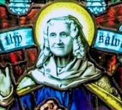 Close-up of the Simeon and Anna window, showing the head of Mary Ann Baker (as if taken from a black and white photo) superimposed on the body of Anna