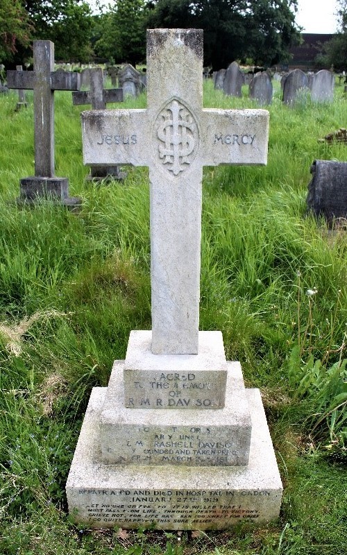 Full photo of Rashell Montague Davison's gravestone, in the style of the cross on which the words 'JESUS' and 'MERCY' can be seen; at it's base, the words 'Sacred to the memory of R M R Davison'