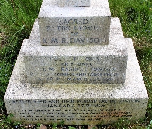 Close-up of the base of Monty's gravestone. Whilst some letters have worn away, the wording 'Sacred to the memory of R M R Davison' is visible, below it wording noting that he was 'wounded and taken prisoner' and finally 'Repatriated and died in hospital in London 27th January 1919', 'Let no one grieve for it is willed that I must pass on from life...'