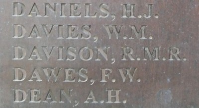 Close-up of the New Malden War Memorial list of names showing 'Davison, R.M.R.' below those of Daniels, H.J. and Davies, W.M. and above Dawes, F.W. and Dean, A.H.