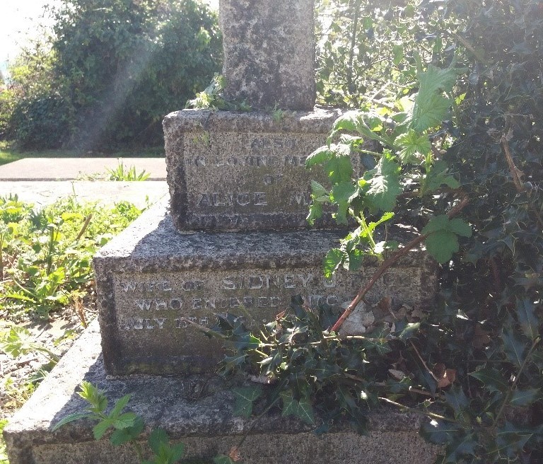 Gravestone of Alice daughter of James and Mary Ann Page (writing is partially obscured by foliage and difficult to read)