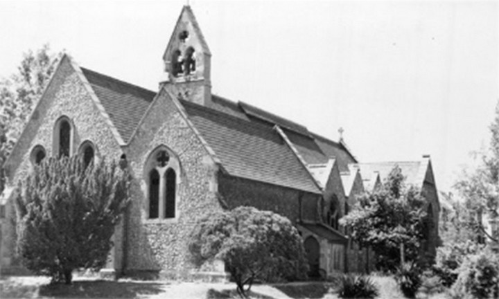 Photo of the church from 1953 showing the east wall; the tree obscures the bottom half of the window